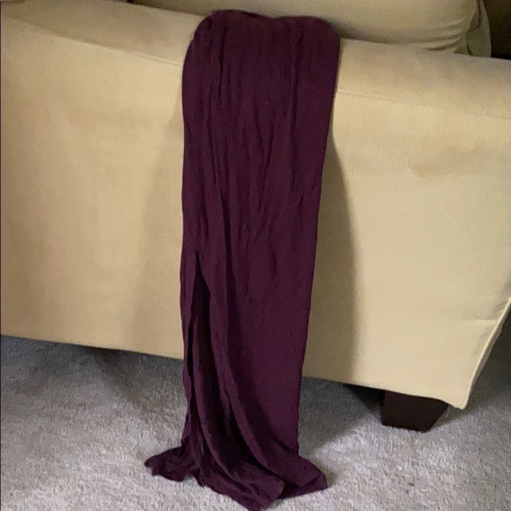 Maroon maxi skirt with splits on both sides.